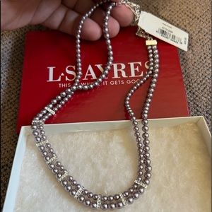 Double strand grey faux pearls with silver colored accents